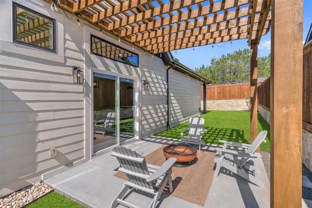 view of patio / terrace featuring a fire pit, a pergola, and a fenced backyard