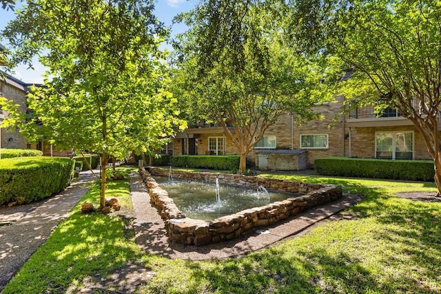 7908 Royal Ln Unit 122B, Dallas, TX 75230 - exterior space with a garden pond