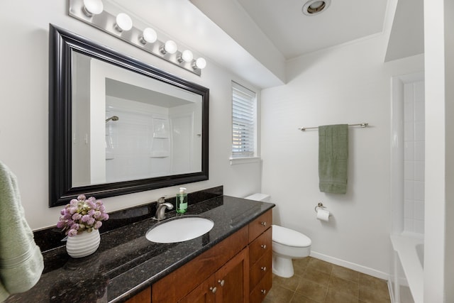 7908 Royal Ln Unit 122B, Dallas, TX 75230 - bathroom featuring toilet, baseboards, vanity, and tile patterned flooring