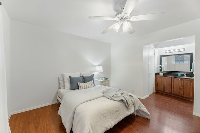 7908 Royal Ln Unit 122B, Dallas, TX 75230 - bedroom with baseboards and wood finished floors