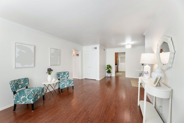 7908 Royal Ln Unit 122B, Dallas, TX 75230 - living area with visible vents, wood finished floors, baseboards, and ornamental molding