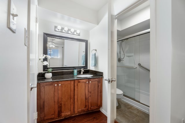 7908 Royal Ln Unit 122B, Dallas, TX 75230 - full bath featuring a stall shower, vanity, and toilet