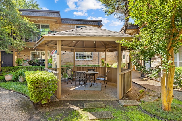 7908 Royal Ln Unit 122B, Dallas, TX 75230 - view of patio / terrace with a gazebo and outdoor dining space
