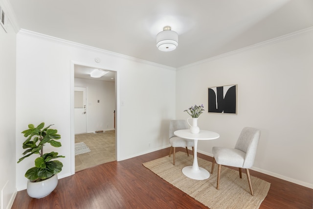 7908 Royal Ln Unit 122B, Dallas, TX 75230 - living area with baseboards, ornamental molding, and wood finished floors