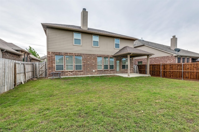 14629 Gilley Ln, Fort Worth, TX 76052 - rear view of property featuring a yard, a patio area, brick siding, and a fenced backyard