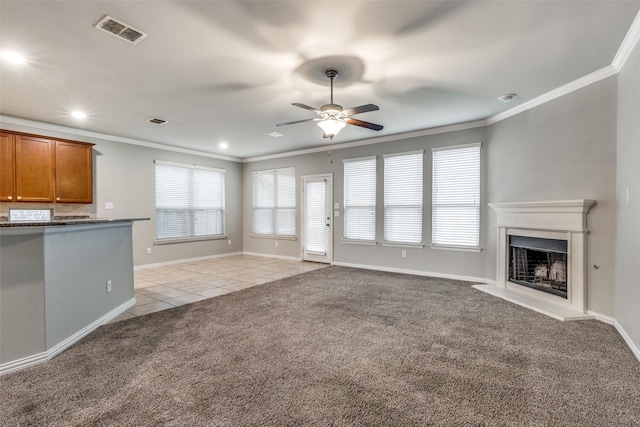 14629 Gilley Ln, Fort Worth, TX 76052 - unfurnished living room with visible vents, a ceiling fan, ornamental molding, and light carpet