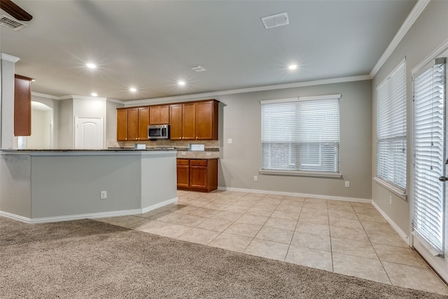 14629 Gilley Ln, Fort Worth, TX 76052 - kitchen featuring ornamental molding, visible vents, and stainless steel microwave