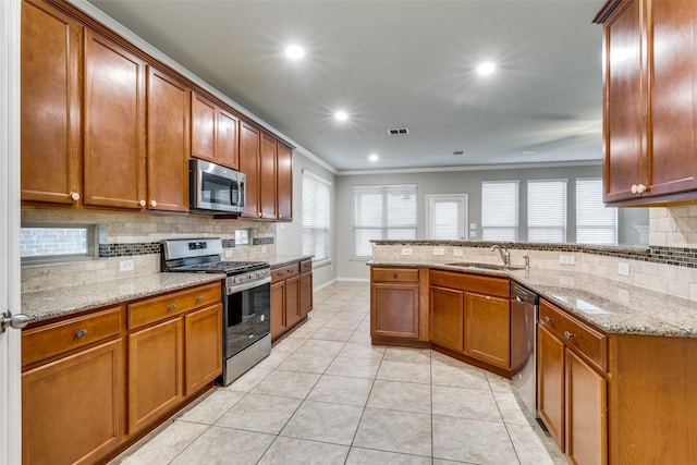 14629 Gilley Ln, Fort Worth, TX 76052 - kitchen with a sink, ornamental molding, stainless steel appliances, and backsplash