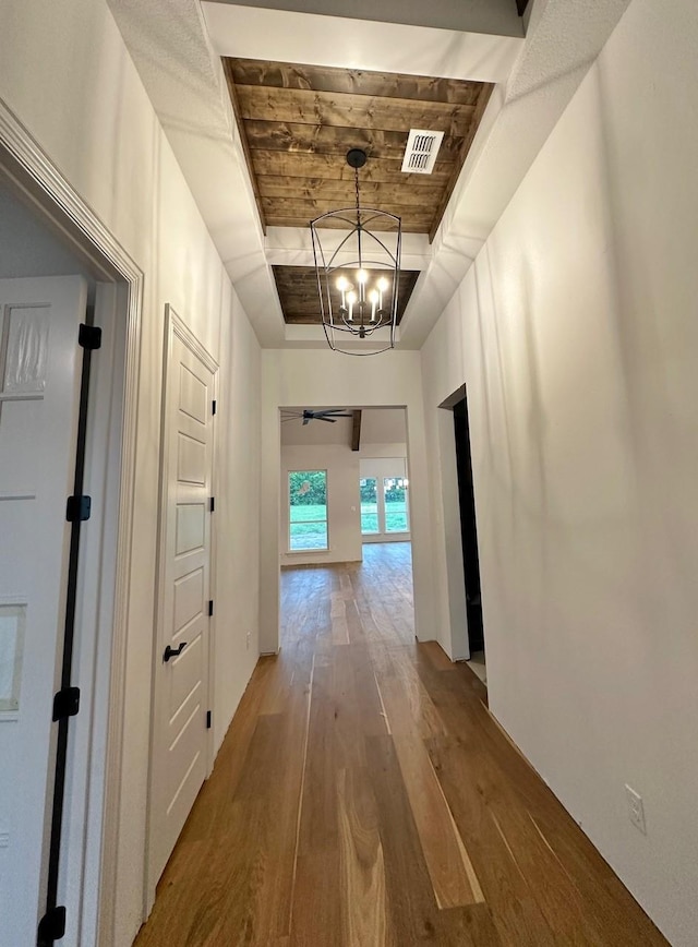 1099 Silver Sage Trl, Weatherford, TX 76085 - corridor with wood finished floors and a chandelier