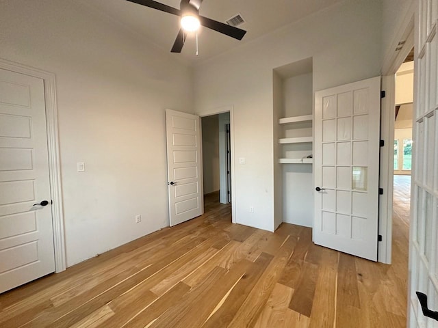 1099 Silver Sage Trl, Weatherford, TX 76085 - unfurnished bedroom featuring light wood-style flooring, a ceiling fan, and a closet