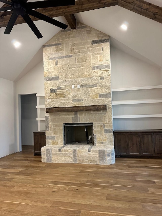 1099 Silver Sage Trl, Weatherford, TX 76085 - unfurnished living room with a fireplace, wood finished floors, a ceiling fan, high vaulted ceiling, and beam ceiling