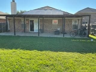 1804 Chicory Ln, Arlington, TX 76010 - back of property featuring a patio area and a chimney
