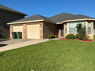 1804 Chicory Ln, Arlington, TX 76010 - single story home with a garage, concrete driveway, a front yard, and brick siding