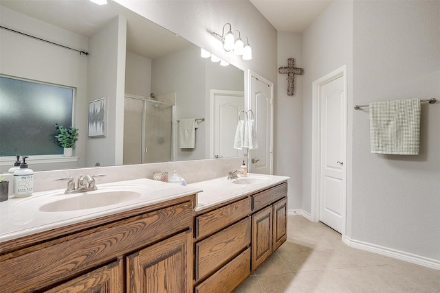 full bath featuring a sink, tile patterned flooring, double vanity, and a stall shower