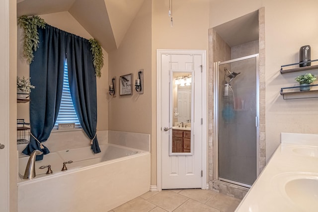 full bathroom with a sink, a shower stall, tile patterned floors, a garden tub, and double vanity