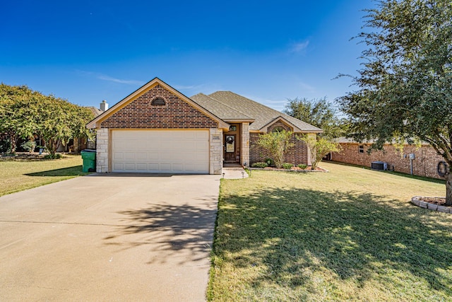 single story home featuring an attached garage, a front lawn, stone siding, and driveway