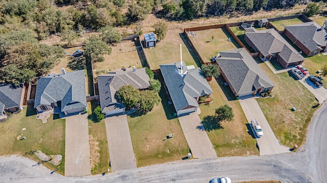 birds eye view of property with a residential view