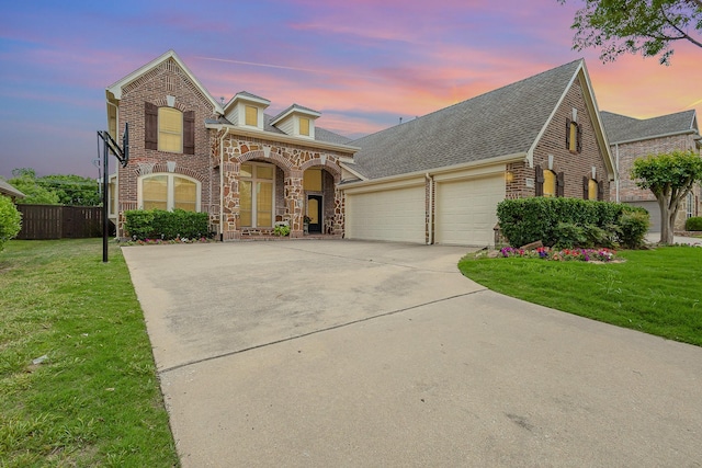 1804 Goodnight Ln, Allen, TX 75002 - french provincial home featuring driveway, an attached garage, and stone siding