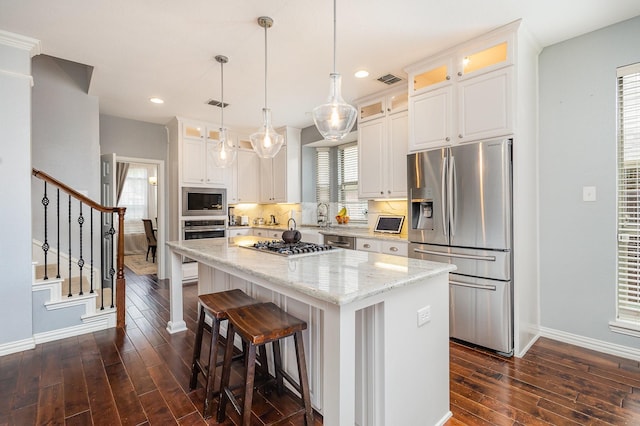 1804 Goodnight Ln, Allen, TX 75002 - kitchen featuring appliances with stainless steel finishes, baseboards, dark wood-style flooring, a center island, and recessed lighting
