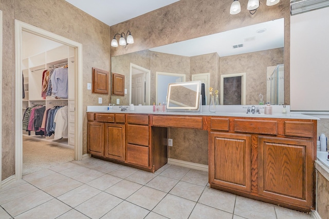 1804 Goodnight Ln, Allen, TX 75002 - full bath with tile patterned floors, double vanity, a shower stall, and a spacious closet