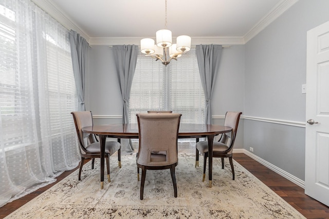 1804 Goodnight Ln, Allen, TX 75002 - dining space featuring a chandelier, crown molding, wood finished floors, and baseboards