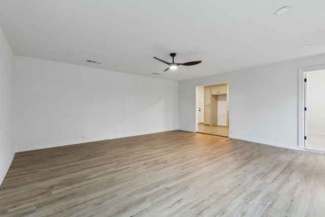 6200 Ravenswood Dr, Fort Worth, TX 76112 - spare room featuring a ceiling fan, light wood-style flooring, and baseboards