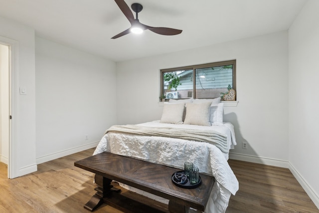 6200 Ravenswood Dr, Fort Worth, TX 76112 - bedroom with wood finished floors, baseboards, and a ceiling fan