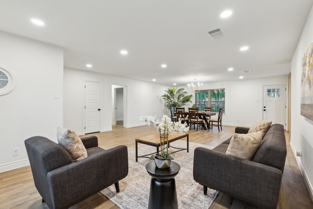 6200 Ravenswood Dr, Fort Worth, TX 76112 - living area with light wood finished floors, recessed lighting, baseboards, and a chandelier