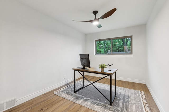 6200 Ravenswood Dr, Fort Worth, TX 76112 - home office with ceiling fan, wood finished floors, and baseboards