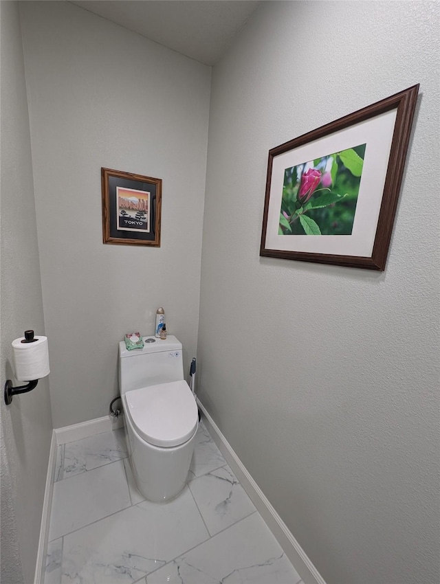 3209 Mimosa Dr, Sherman, TX 75092 - bathroom featuring marble finish flooring, baseboards, and toilet
