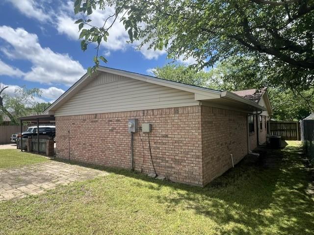 3209 Mimosa Dr, Sherman, TX 75092 - view of home's exterior featuring brick siding