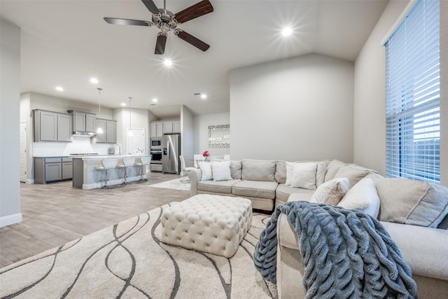 2100 Blackcap St, Denton, TX 76205 - living room featuring light wood finished floors, baseboards, ceiling fan, and recessed lighting
