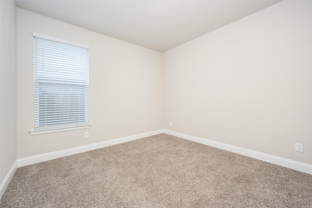 2100 Blackcap St, Denton, TX 76205 - carpeted empty room with baseboards and a healthy amount of sunlight