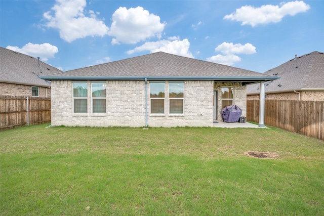 2100 Blackcap St, Denton, TX 76205 - rear view of property with a yard, brick siding, a patio area, and a fenced backyard