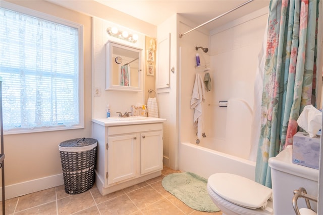 1501 W Crawford St W, Denison, TX 75020 - full bath with vanity, toilet, a wealth of natural light, and shower / bath combo