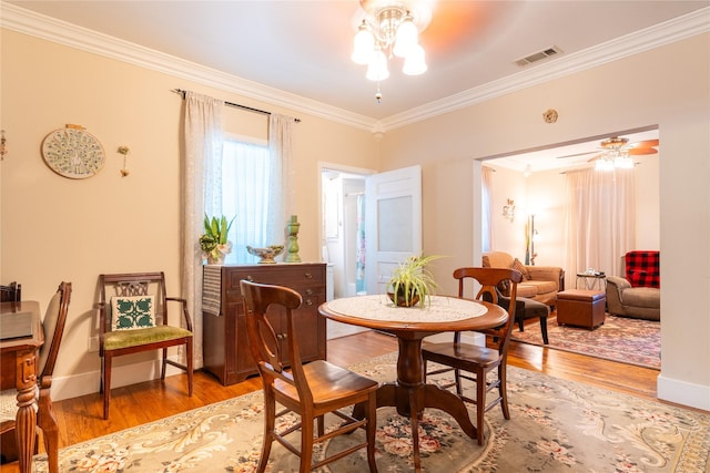 1501 W Crawford St W, Denison, TX 75020 - dining space with ornamental molding, visible vents, ceiling fan, baseboards, and light wood-style floors