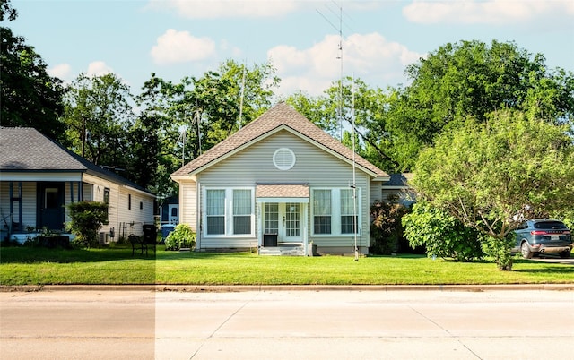1501 W Crawford St W, Denison, TX 75020 - view of front of house featuring a shingled roof and a front lawn