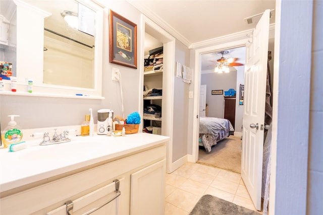 1501 W Crawford St W, Denison, TX 75020 - bathroom featuring vanity, visible vents, ceiling fan, crown molding, and tile patterned flooring
