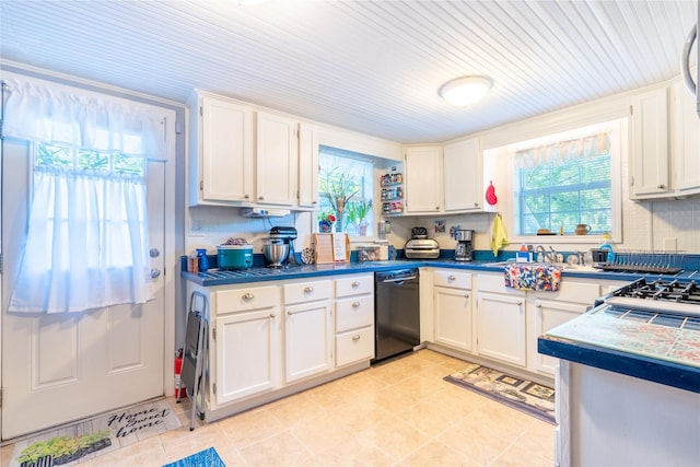 1501 W Crawford St W, Denison, TX 75020 - kitchen with dishwasher, white cabinetry, light tile patterned floors, and a sink