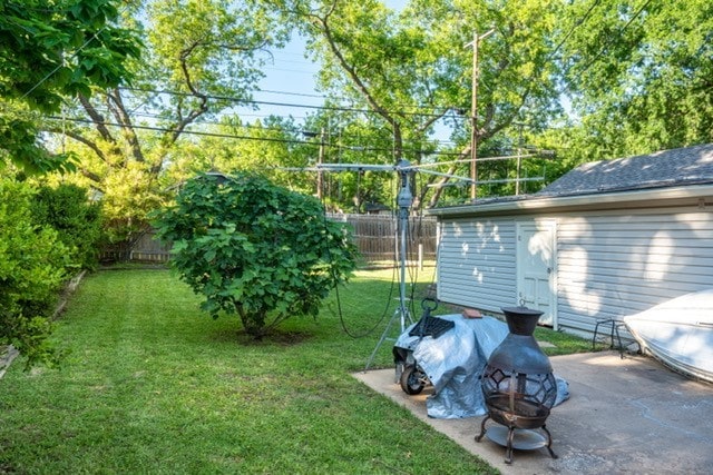 1501 W Crawford St W, Denison, TX 75020 - view of yard with an outdoor fire pit and a fenced backyard