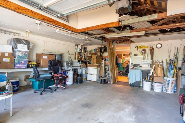 1501 W Crawford St W, Denison, TX 75020 - garage with a garage door opener and a workshop area