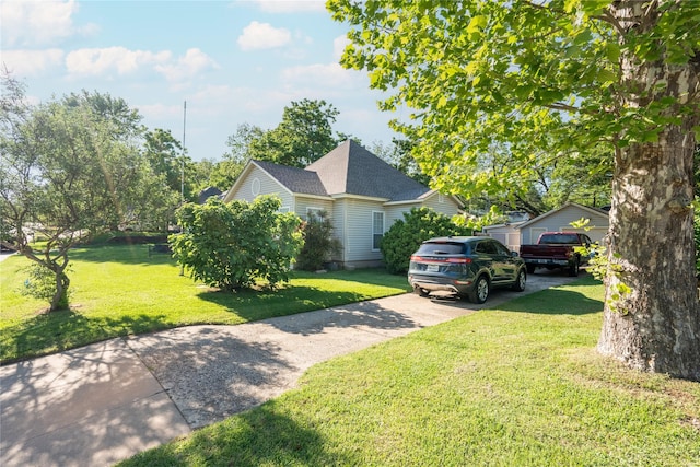 1501 W Crawford St W, Denison, TX 75020 - view of front of home with driveway, a shingled roof, and a front lawn