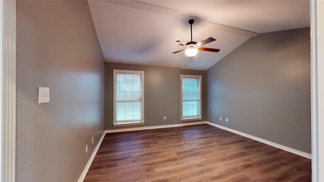 10020 Richard Cir, Forney, TX 75126 - spare room featuring dark wood-style flooring, lofted ceiling, baseboards, and a ceiling fan