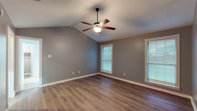 10020 Richard Cir, Forney, TX 75126 - unfurnished room featuring vaulted ceiling, baseboards, a ceiling fan, and wood finished floors