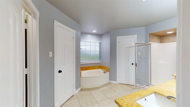 10020 Richard Cir, Forney, TX 75126 - full bathroom with a sink, tile patterned floors, a bath, baseboards, and a shower stall