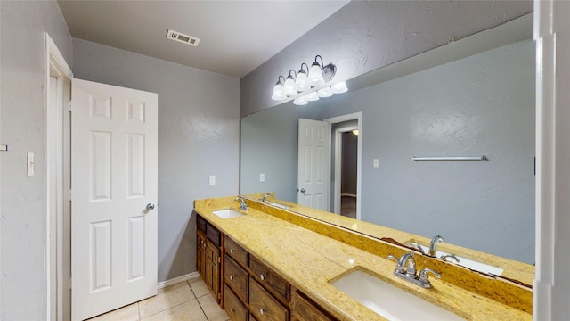 10020 Richard Cir, Forney, TX 75126 - full bathroom featuring double vanity, visible vents, tile patterned flooring, and a sink