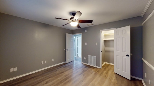 10020 Richard Cir, Forney, TX 75126 - unfurnished bedroom with baseboards, visible vents, and wood finished floors