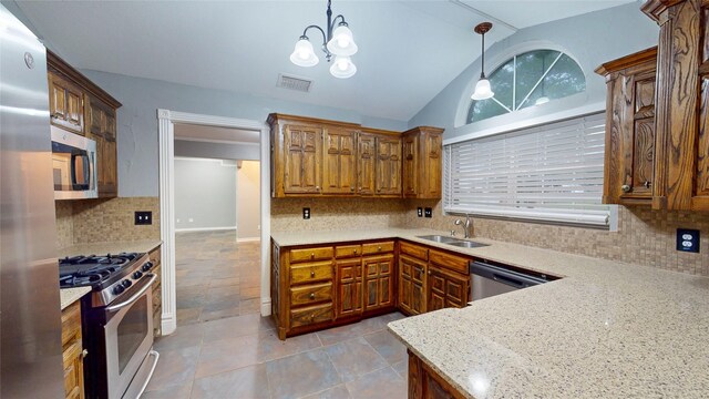 10020 Richard Cir, Forney, TX 75126 - kitchen featuring a sink, lofted ceiling, tasteful backsplash, visible vents, and appliances with stainless steel finishes