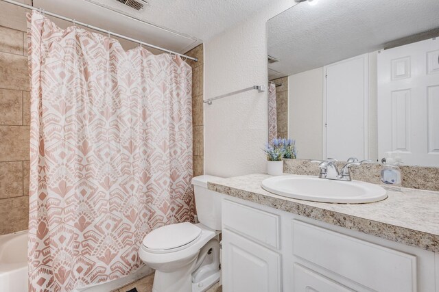 8110 Skillman St Unit 1059, Dallas, TX 75231 - full bathroom featuring vanity, a textured ceiling, and shower / tub combo with curtain