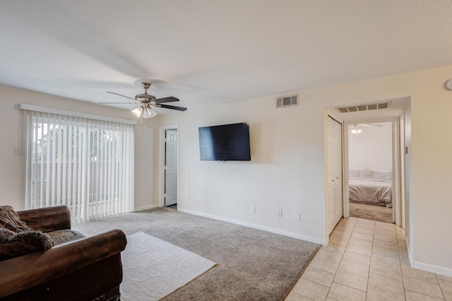 8110 Skillman St Unit 1059, Dallas, TX 75231 - living room with a ceiling fan, baseboards, and light tile patterned floors